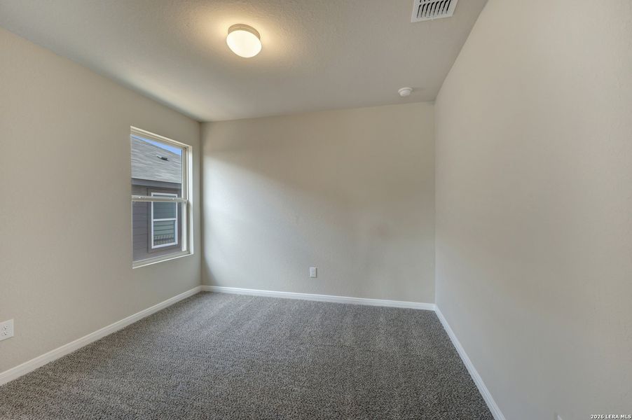 Spacious, unfurnished interior of a new home in Hunters Ranch, San Antonio (Image 26).