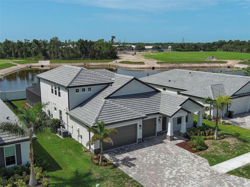 Front exterior of a new home in , Nokomis, FL, highlighting curb appeal (Image 29). Front exterior of a new home in , Nokomis, FL, highlighting curb appeal (Image 29).