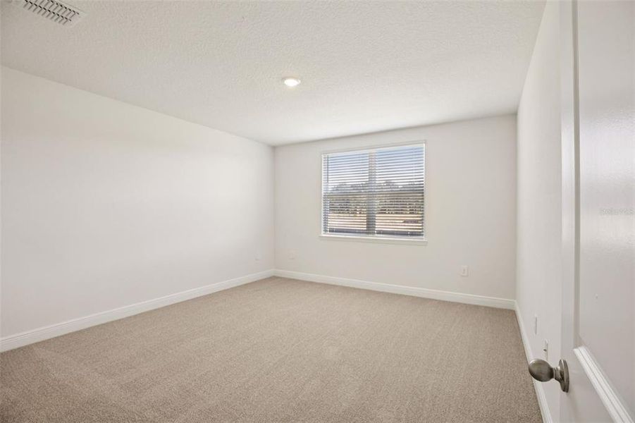 Spacious, unfurnished interior of a new home in The Reserve at Hammock Oaks - Signature Series, Lady Lake (Image 37). Spacious, unfurnished interior of a new home in The Reserve at Hammock Oaks - Signature Series, Lady Lake (Image 37).