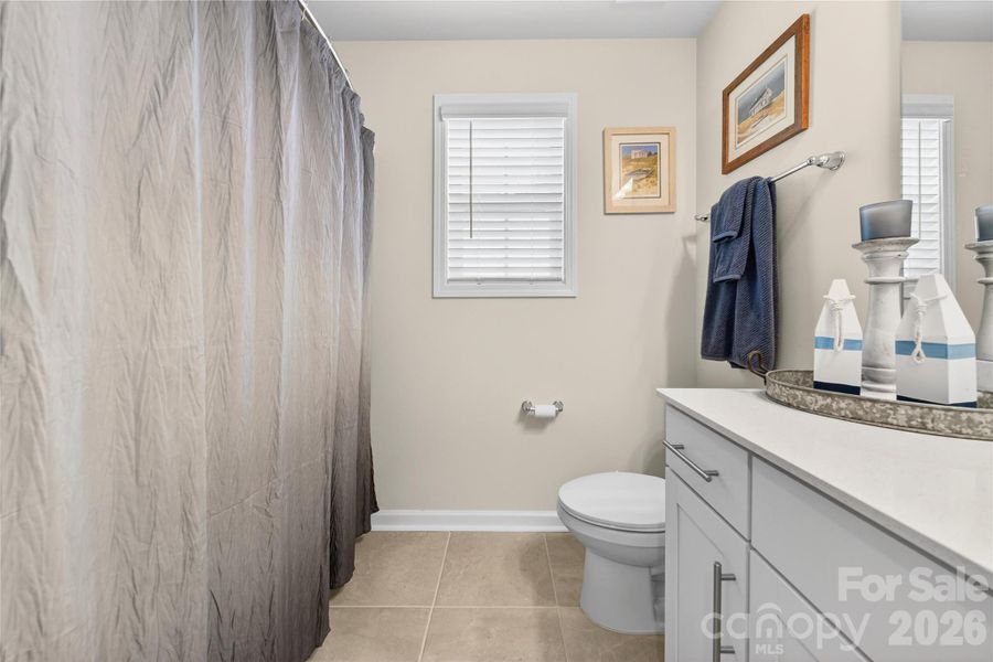 Hall bath serves bedrooms 3 and 4.