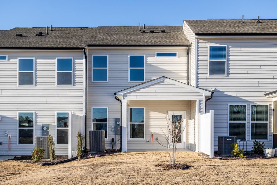 Exterior details and patio area of a home in 1158 Place Townhomes, Wilson (Image 3).