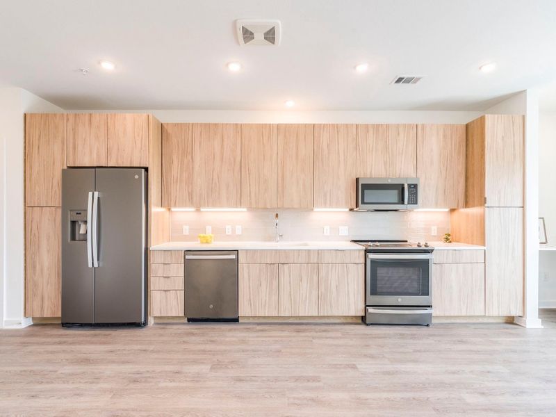 Light and bright kitchen with soft close cabinets, stainless steel appliances and recessed lighting. Light and bright kitchen with soft close cabinets, stainless steel appliances and recessed lighting.