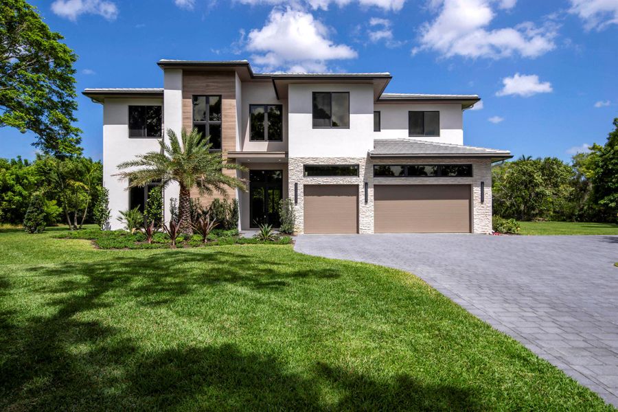 Front exterior of a new home in , Palm Beach Gardens, FL, highlighting curb appeal (Image 22).