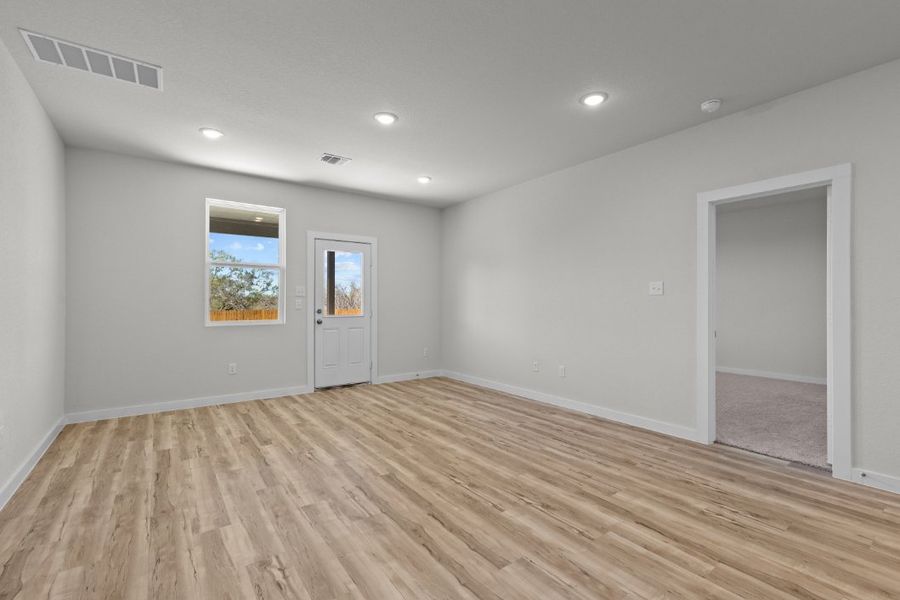 A room with a wood floor and a wood floor. A room with a wood floor and a wood floor.