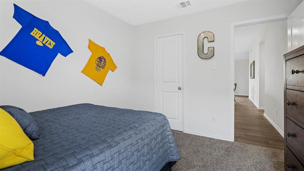 Bedroom featuring light gray walls and carpeted flooring