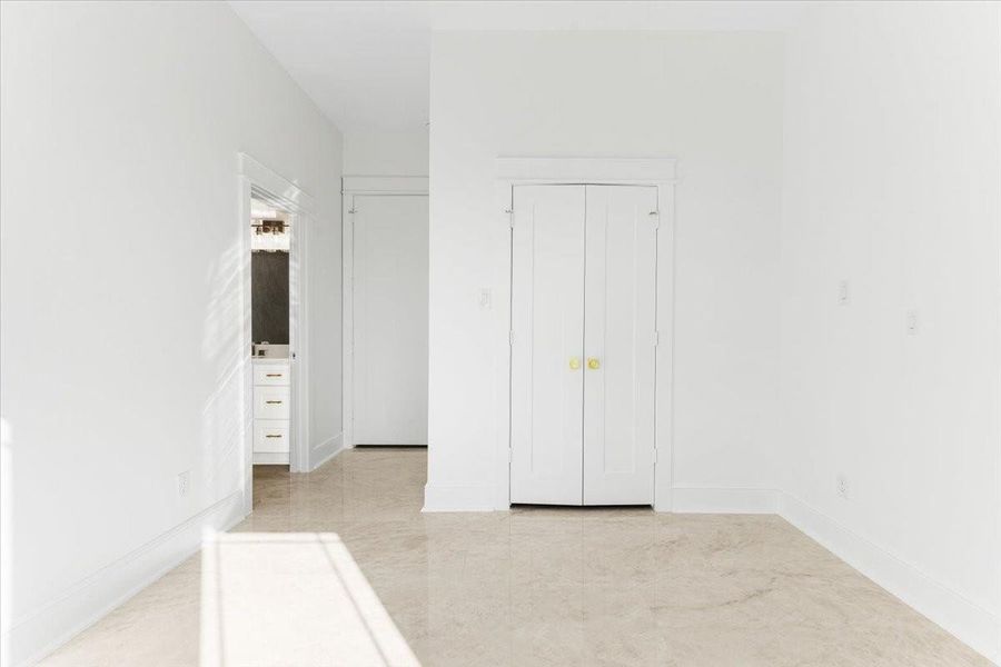 Another view of the bedroom highlighting its spacious layout and ample closet space. Another view of the bedroom highlighting its spacious layout and ample closet space.