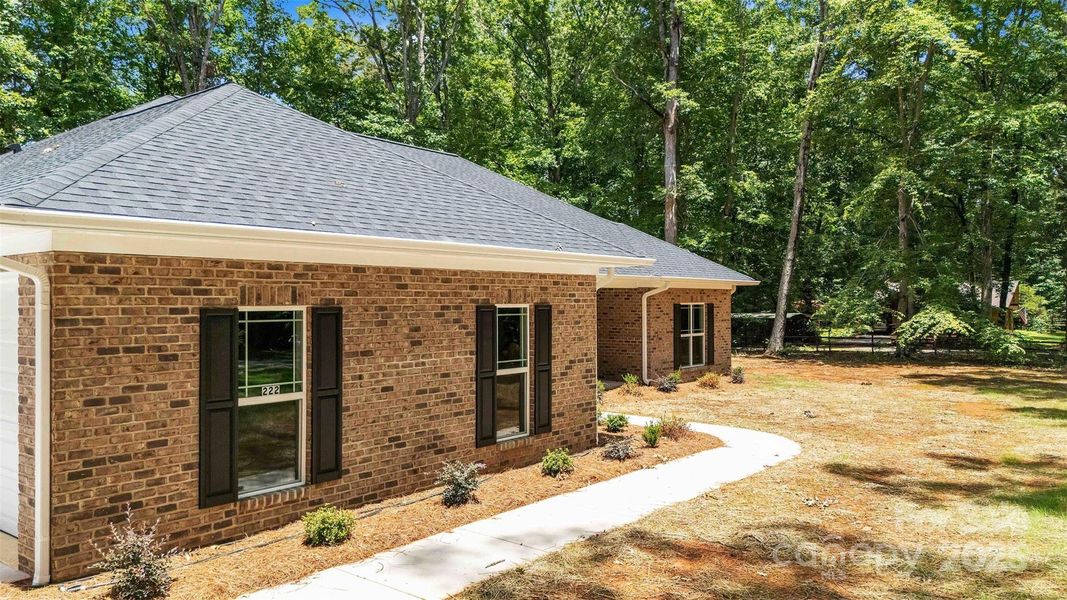 Front exterior of a new home in , Mocksville, NC, highlighting curb appeal (Image 21).