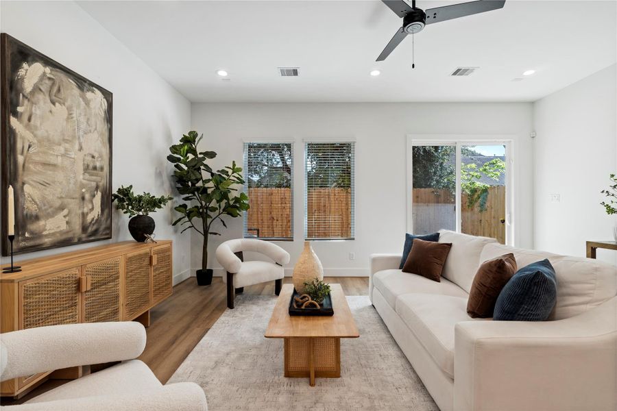 Natural light streams through expansive windows, bathing every corner of this inviting home in a serene glow from dawn till dusk. Experience tranquility and warmth in every room.