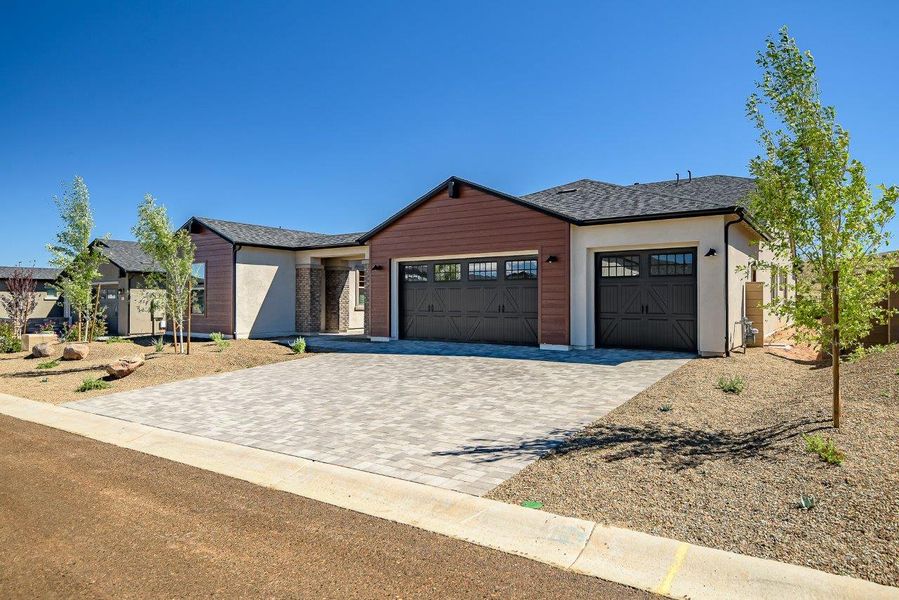 Front exterior of a new home in Summit at The Dells, Prescott, AZ, highlighting curb appeal (Image 18).