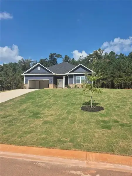 Front exterior of a new home in , Griffin, GA, highlighting curb appeal (Image 1). Front exterior of a new home in , Griffin, GA, highlighting curb appeal (Image 1).