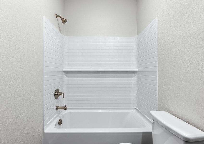 The secondary bathroom has a shower-tub combo.