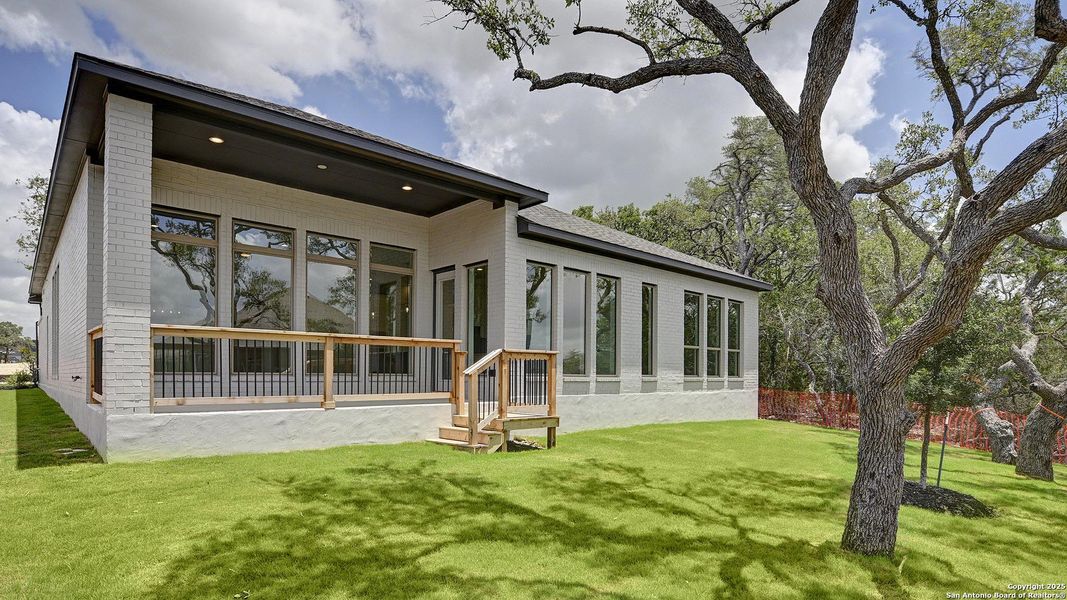 Front exterior of a new home in Esperanza 60', Boerne, TX, highlighting curb appeal (Image 27).