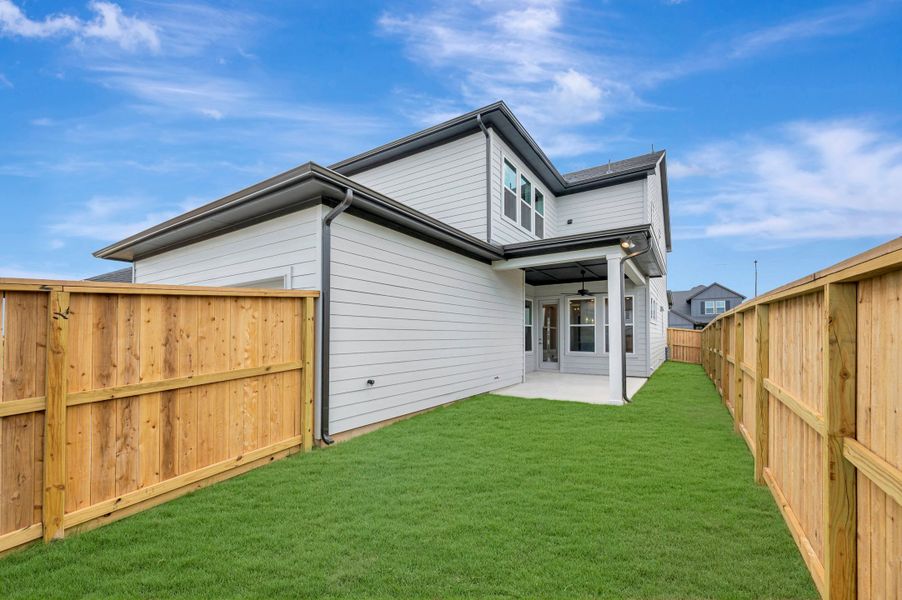 Exterior details and patio area of a home in Elyson - Grove Row Collection, Katy (Image 4).