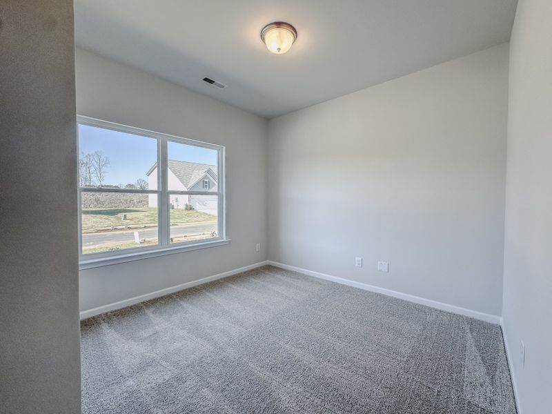 Representative unfurnished interior of a home built from the The Hampton by Smith Douglas Homes in Enclave at Willis, Willis (Image 14).