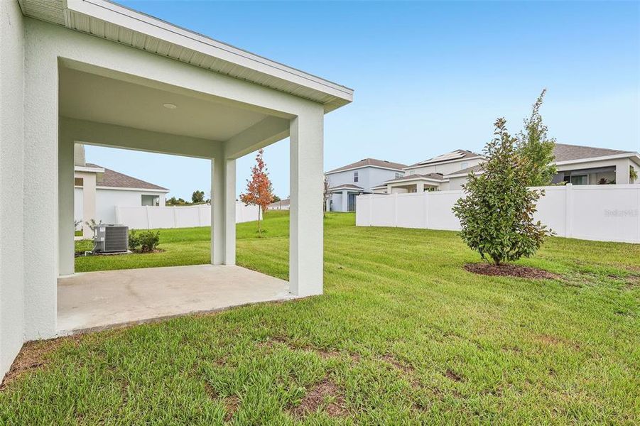Exterior details and patio area of a home in Eagletail Landings, Howey-in-the-Hills (Image 3).