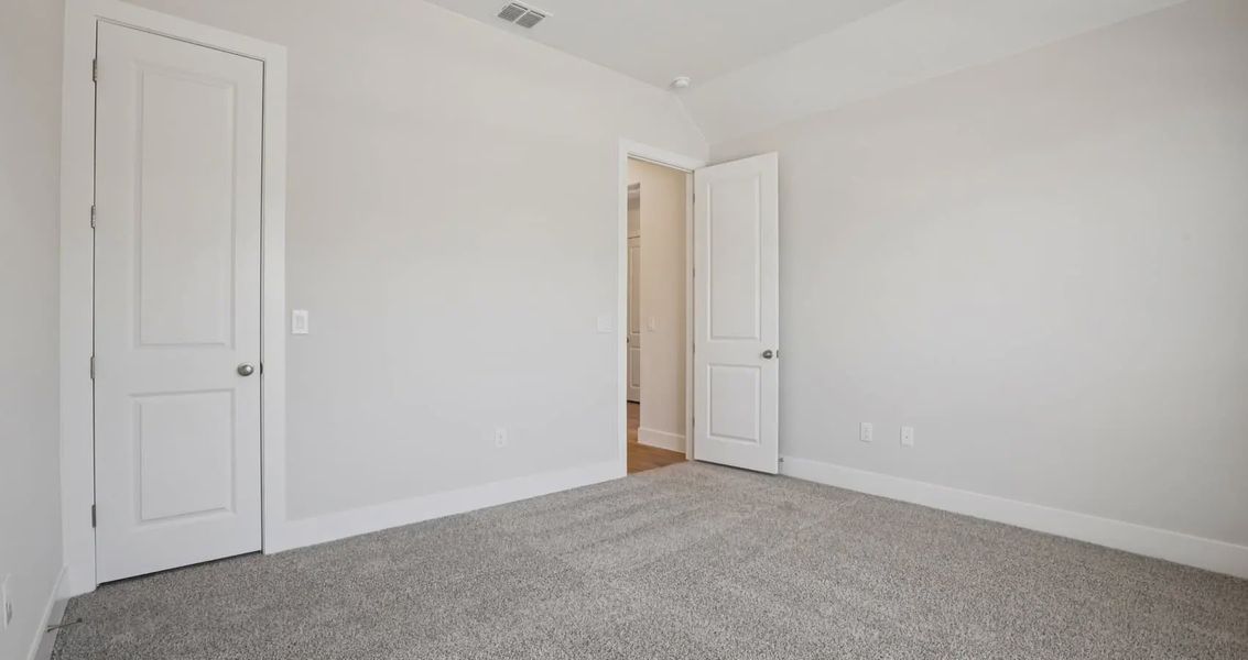 Spacious, unfurnished interior of a new home in 6 Creeks, Kyle (Image 14).