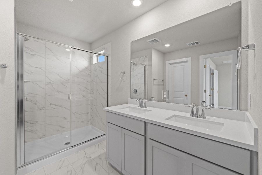 Primary Bath retreat with dual vanities & walk-in shower