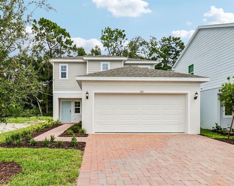 Front exterior of a new home in Beresford Woods, Deland, FL, highlighting curb appeal (Image 2). Front exterior of a new home in Beresford Woods, Deland, FL, highlighting curb appeal (Image 2).