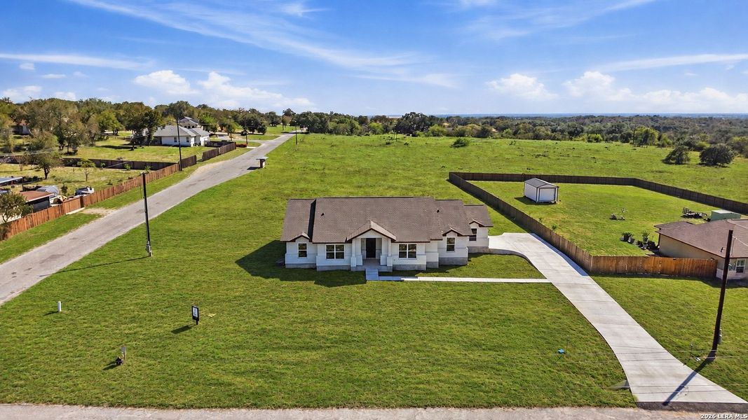Front exterior of a new home in , Poteet, TX, highlighting curb appeal (Image 27).