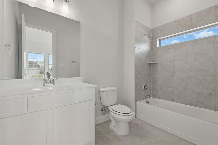 Bathroom featuring vanity and bathing tub / shower combination