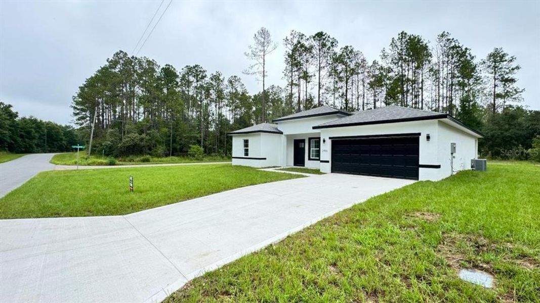 Front exterior of a new home in , Citrus Springs, FL, highlighting curb appeal (Image 18).