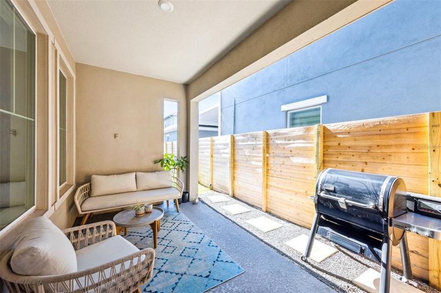 Exterior details and patio area of a home in Laureate Park at Lake Nona - Garden Series, Orlando (Image 3).