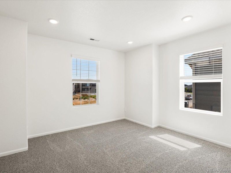 Spacious, unfurnished interior of a new home in Ridgeline Vista: The Flora Collection, Brighton (Image 30).