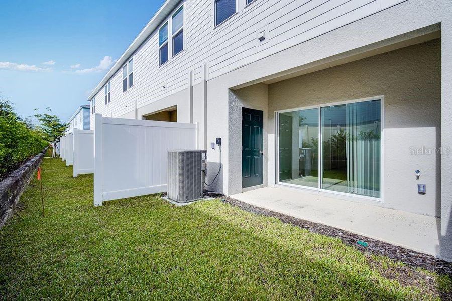 Exterior details and patio area of a home in The Townhomes at Skye Ranch, Sarasota (Image 26).
