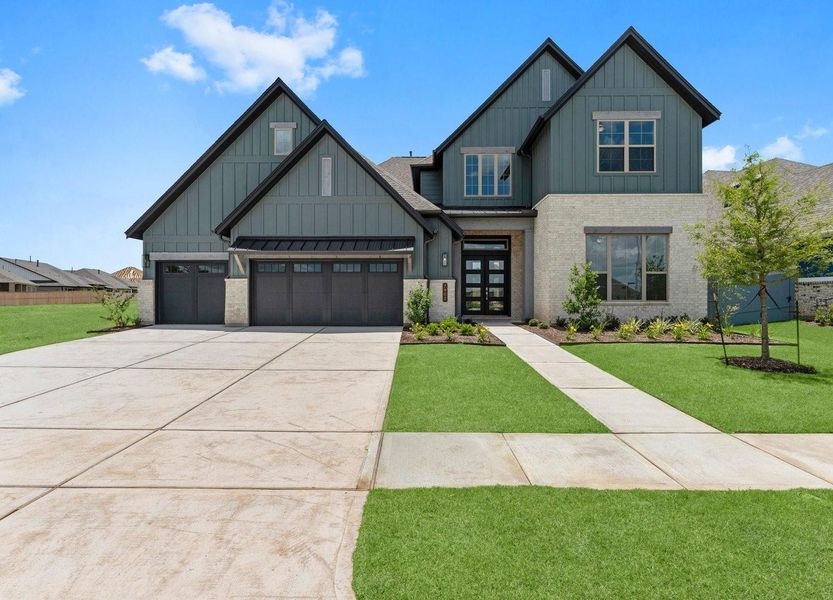 Front exterior of a new home in Fulshear Lakes 70’s, Fulshear, TX, highlighting curb appeal (Image 20). Front exterior of a new home in Fulshear Lakes 70’s, Fulshear, TX, highlighting curb appeal (Image 20).
