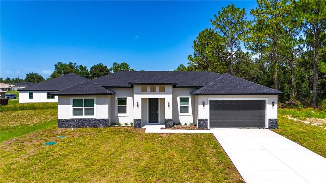 Front exterior of a new home in , Ocala, FL, highlighting curb appeal (Image 23).