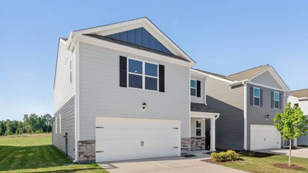 Front exterior of a new home in Belle Grove, Wendell, NC, highlighting curb appeal (Image 2). Front exterior of a new home in Belle Grove, Wendell, NC, highlighting curb appeal (Image 2).