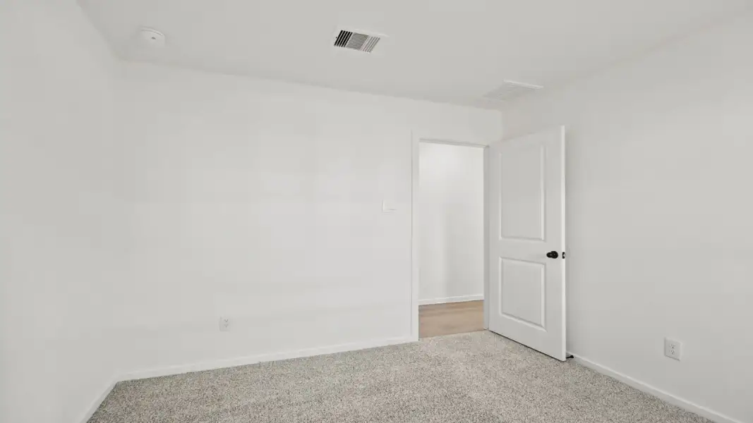 Spacious, unfurnished interior of a new home in The Canopies, Splendora (Image 13).