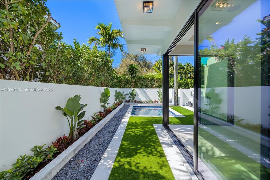 Exterior details and patio area of a home in , Coral Gables (Image 24).