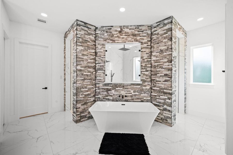 Relaxing soaking tub positioned as the centerpiece of the bathroom.