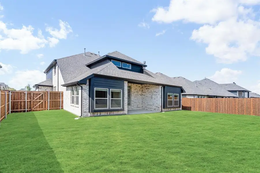 Exterior details and patio area of a home in Devonshire, Forney (Image 4).