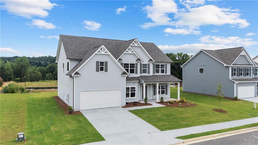 Front exterior of a new home in Hampton Ridge, Jefferson, GA, highlighting curb appeal (Image 2). Front exterior of a new home in Hampton Ridge, Jefferson, GA, highlighting curb appeal (Image 2).