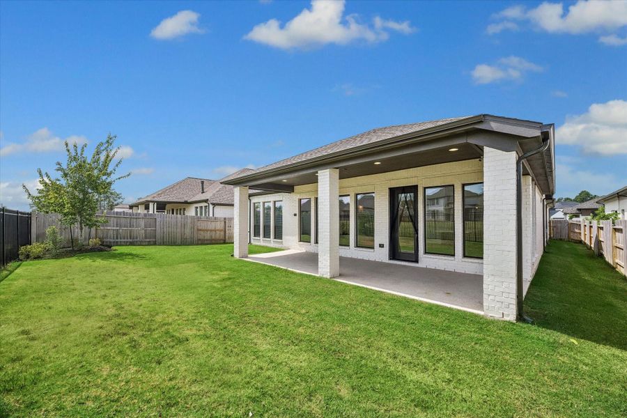 Exterior details and patio area of a home in Artavia, Conroe (Image 15).