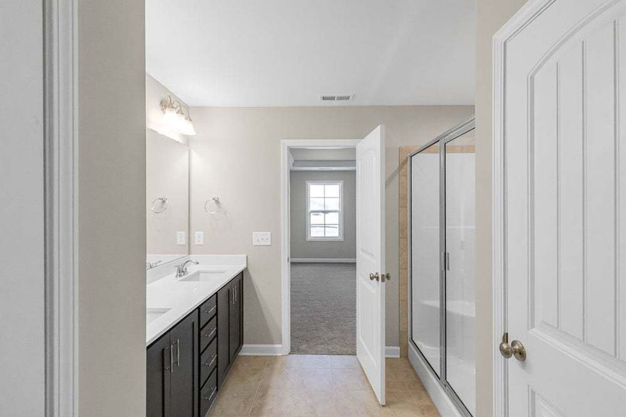 Representative furnished interior of a home built from the Magnolia by Caviness & Cates Communities in Bartlett Manor, Youngsville (Image 57).