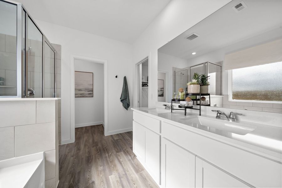 A bathroom with white cabinets. A bathroom with white cabinets.