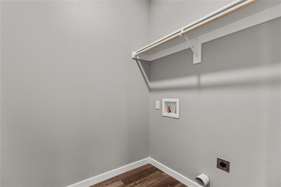 Laundry area featuring hookup for an electric dryer, dark wood finished floors, and hookup for a washing machine