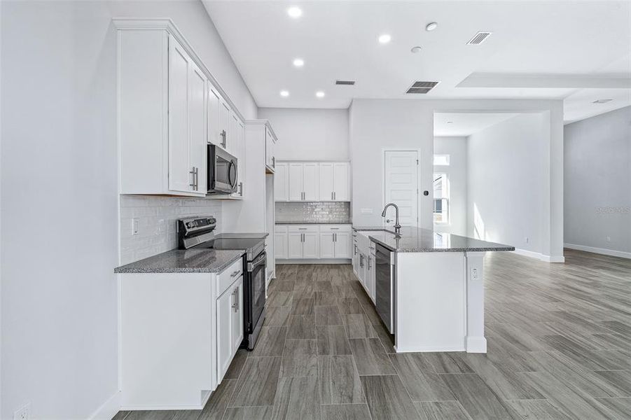 Furnished interior view inside a new home in , Palm Coast (Image 7). Furnished interior view inside a new home in , Palm Coast (Image 7).