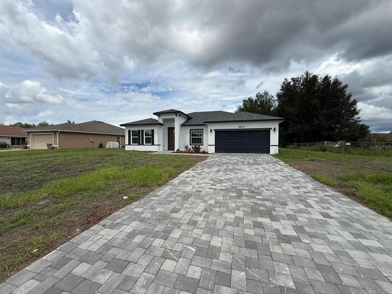 Front exterior of a new home in , Ocala, FL, highlighting curb appeal (Image 1). Front exterior of a new home in , Ocala, FL, highlighting curb appeal (Image 1).