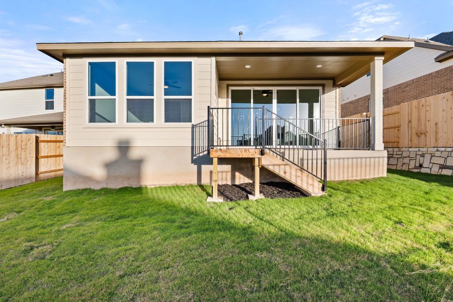 Exterior details and patio area of a home in Lariat, Liberty Hill (Image 30).