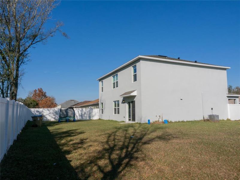 Exterior details and patio area of a home in Poinciana Enclave, Kissimmee (Image 16).