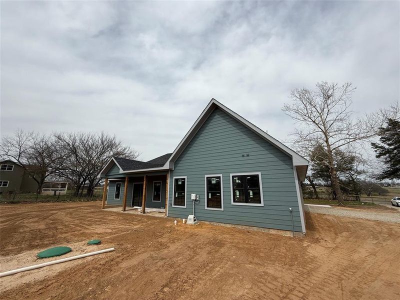 Rear view of property featuring a porch