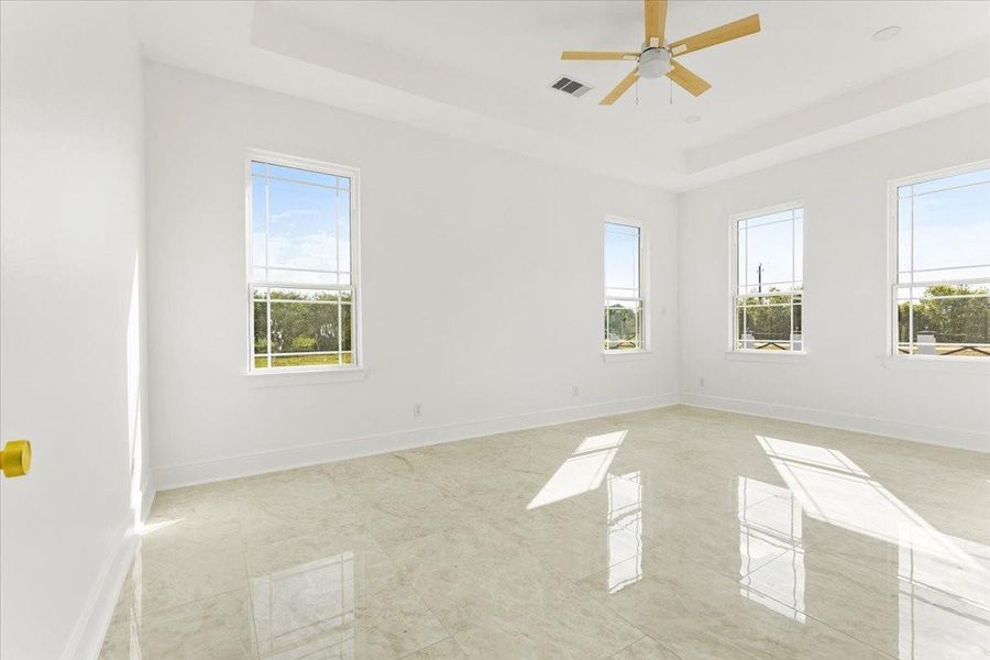 Primary bedroom offering abundant natural light and plenty of room for large furnishings. Primary bedroom offering abundant natural light and plenty of room for large furnishings.