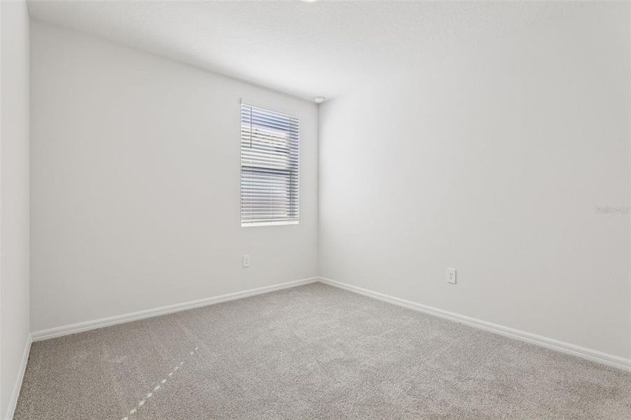 Spacious, unfurnished interior of a new home in Lake Deer Estates - Signature Series, Poinciana (Image 25).