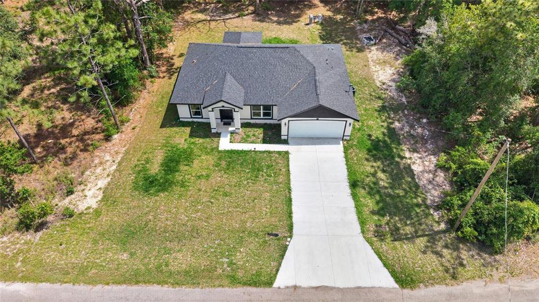 Front exterior of a new home in , Ocklawaha, FL, highlighting curb appeal (Image 22).