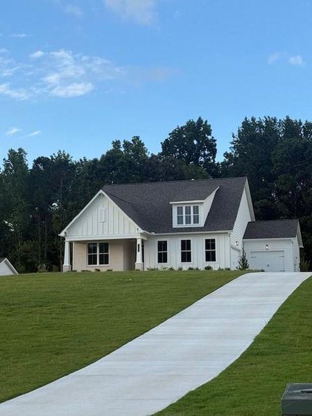 Front exterior of a new home in , Canton, GA, highlighting curb appeal (Image 1).