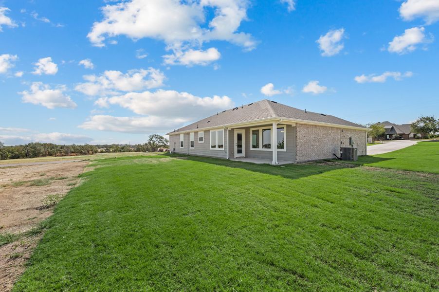 Exterior details and patio area of a home in Gatlin Ranch, Springtown (Image 4).